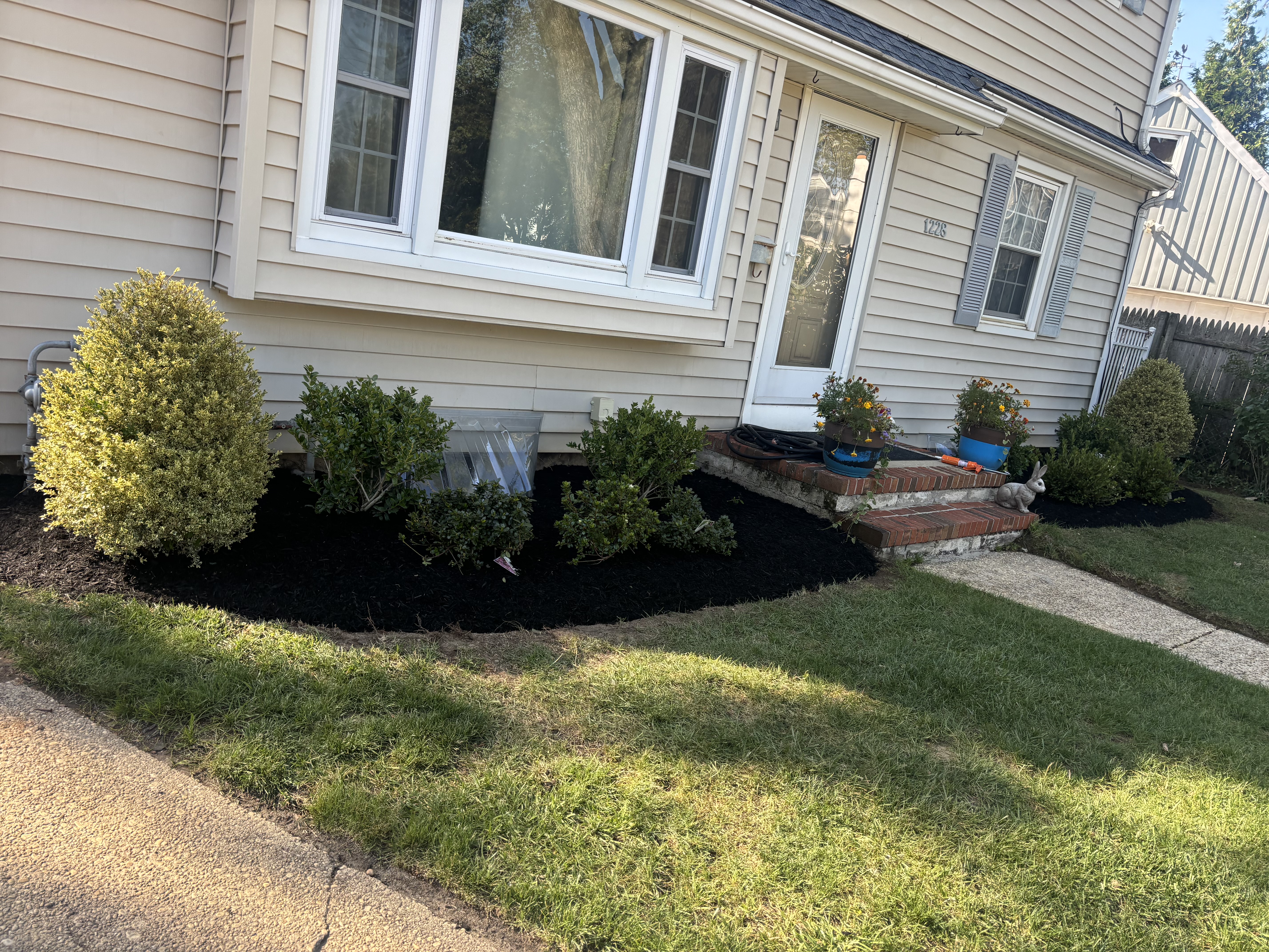 Backyard after landscaping and mulching service in New Jersey